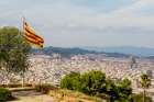 Catalan flag over the Montjuic Castle old fortress, Montjuic Mountain overlooking Barcelona, Spain. Art Print